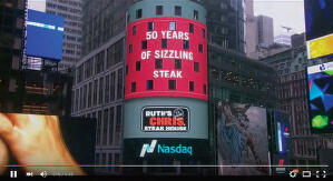 Thumbnail of Youtube video showing Ruth's Chris logo on NASDAQ Tower